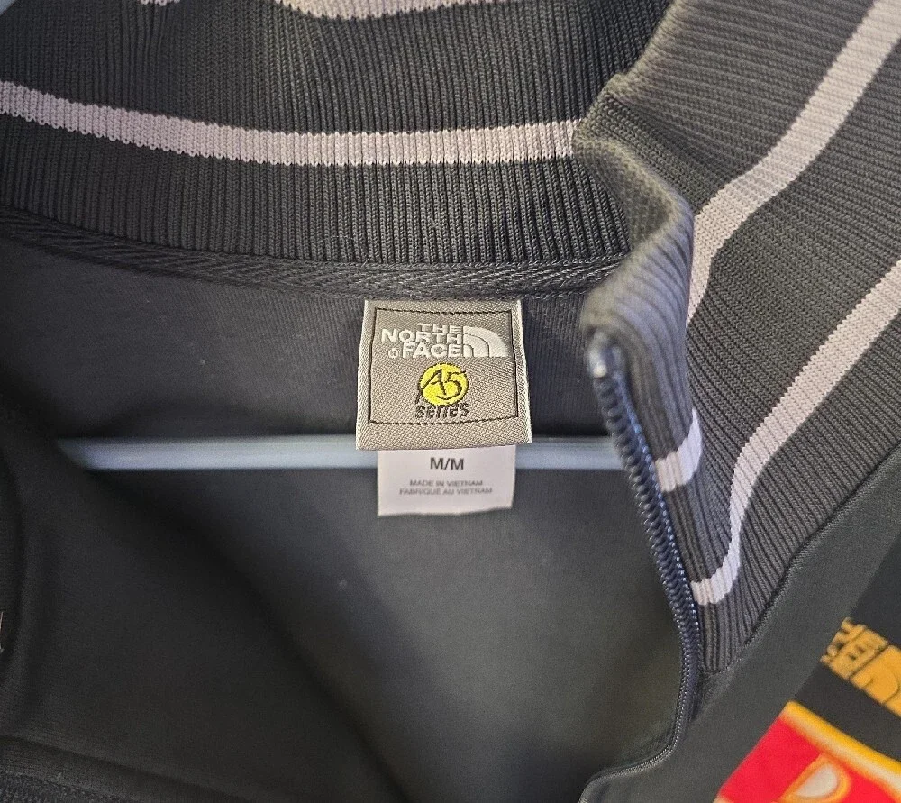 The North Face Dark Green Track Jacket with Red & Yellow Accents